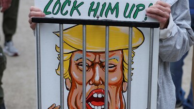 An attendee holds a placard during a No Kings Day protest against U.S. President Donald Trump's policies, in Philadelphia, Pennsylvania, U.S., June 14, 2025. REUTERS/Lee Smith (REUTERS)