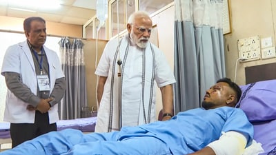 Prime Minister Narendra Modi meets Vishwash Kumar Ramesh, the lone survivor of yesterday's Air India plane crash, at a hospital, in Ahmedabad. (PMO)