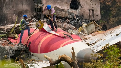 Wreckage of the crashed Air India plane being lifted through a crane, in Ahmedabad, Gujarat, Saturday, June 14 (PTI) Wreckage of the crashed Air India plane being lifted through a crane, in Ahmedabad, Gujarat, Saturday, June 14 (PTI)