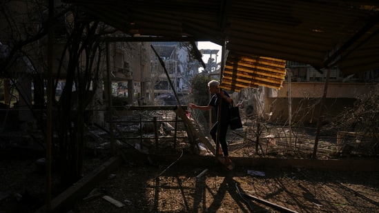 People look at a destroyed residential building that was hit by a missile fired from Iran, in Ramat Gan, near Tel Aviv, Israel on Saturday, June 14, 2025.(Ariel Schalit/AP)