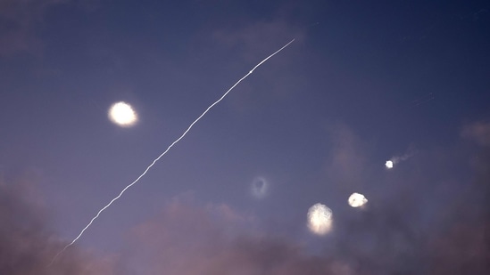 This photo shows rocket trails and intercepts in the sky over the Israeli city of Netanya on June 14, 2025. Iran struck Israel early June 14 with barrages of missiles after a massive onslaught targeted the Islamic republic's nuclear and military facilities.(AFP)
