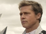 This image released by Apple TV+ shows Damson Idris as Joshua Pearce, left, and Brad Pitt as Sonny Hayes in a scene from "F1 The Movie." (Apple TV+ via AP)