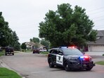 Law enforcement establish a security perimeter near the residence of senior Democratic state assemblywoman, Melissa Hortman.
