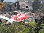 The wreckage of the crashed Air India plane is being lifted by a crane from the roof of the BJ Medical College mess building. The wreckage of the crashed Air India plane is being lifted by a crane from the roof of the BJ Medical College mess building.