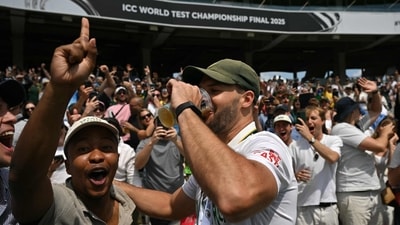 Aiden Markram enjoys a beer with a fan in the Lord's crowd, who he revealed to be a friend from school. (AFP) Aiden Markram enjoys a beer with a fan in the Lord's crowd, who he revealed to be a friend from school. (AFP)