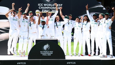 South Africa's Temba Bavuma lifts the ICC Test Championship Mace on the podium with teammates after winning the final (Action Images via Reuters)