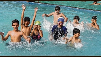 Children splash in a swimming pool on a scorching afternoon in Chandigarh. (Keshav Singh/HT) Children splash in a swimming pool on a scorching afternoon in Chandigarh. (Keshav Singh/HT)
