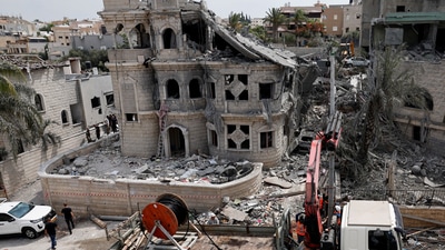 A view of a damaged residential buildings and vehicles after impact from missiles fired from Iran, in northern Israel, in Tamra, Israel. (REUTERS)