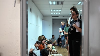 Israelis take cover in a public shelter during a missile attack on Israel from Iran, at Haifa, Israel. (REUTERS)