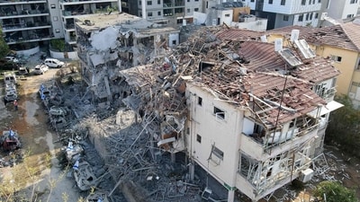 This aerial picture shows damaged buildings at a site hit by a missile fired from Iran in the Israeli city of Ramat Gan near Tel Aviv. (Jack Guez/AFP) This aerial picture shows damaged buildings at a site hit by a missile fired from Iran in the Israeli city of Ramat Gan near Tel Aviv. (Jack Guez/AFP)