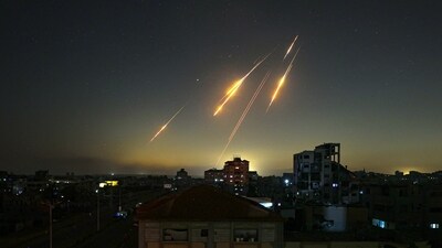 This picture taken from Nuseirat, in the central Gaza Strip, shows rocket trails in the sky late on June 13, 2025, after Iran struck Israel with barrages of missiles after a massive onslaught targeted the Islamic republic's nuclear and military facilities. (Eyad Baba/AFP) This picture taken from Nuseirat, in the central Gaza Strip, shows rocket trails in the sky late on June 13, 2025, after Iran struck Israel with barrages of missiles after a massive onslaught targeted the Islamic republic's nuclear and military facilities. (Eyad Baba/AFP)