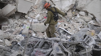 An Israeli soldier navigates the rubble of a residential building that was hit by a missile fired from Iran, near Tel Aviv, Israel, Sunday, June 15, 2025. (AP Photo/Ariel Schalit) An Israeli soldier navigates the rubble of a residential building that was hit by a missile fired from Iran, near Tel Aviv, Israel, Sunday, June 15, 2025. (AP Photo/Ariel Schalit)
