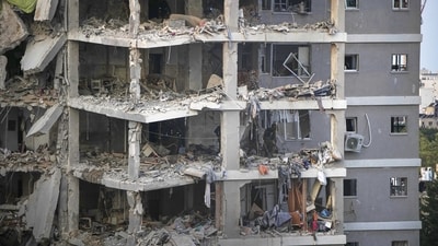 Israeli soldiers inspect destroyed buildings that were hit by a missile fired from Iran, near Tel Aviv, Israel, Sunday, June 15, 2025. (AP) Israeli soldiers inspect destroyed buildings that were hit by a missile fired from Iran, near Tel Aviv, Israel, Sunday, June 15, 2025. (AP)