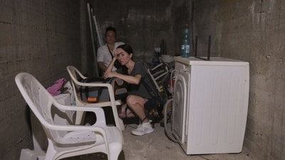 Israeli locals stay in a shelter of a residential area that was hit by a missile fired from Iran, near Tel Aviv, Israel, early Sunday, June 15, 2025. (AP Photo/Ohad Zwigenberg) Israeli locals stay in a shelter of a residential area that was hit by a missile fired from Iran, near Tel Aviv, Israel, early Sunday, June 15, 2025. (AP Photo/Ohad Zwigenberg)