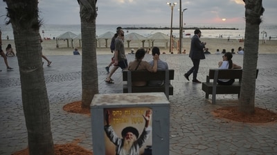 People walk along the beachfront promenade in Tel Aviv, Israel, on Saturday, June 14, 2025. (AP Photo/Ohad Zwigenberg) People walk along the beachfront promenade in Tel Aviv, Israel, on Saturday, June 14, 2025. (AP Photo/Ohad Zwigenberg)