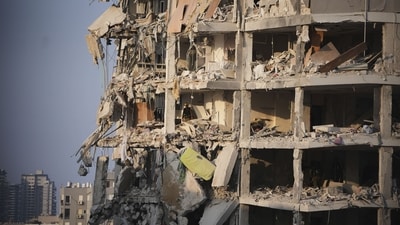Israeli security forces inspect a destroyed building that was hit by a missile fired from Iran, near Tel Aviv, Israel, Sunday, June 15, 2025. (AP Photo/Ohad Zwigenberg) Israeli security forces inspect a destroyed building that was hit by a missile fired from Iran, near Tel Aviv, Israel, Sunday, June 15, 2025. (AP Photo/Ohad Zwigenberg)