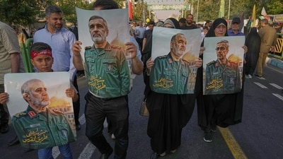Demonstrators carry posters of top Iranian commanders killed in Friday's Israeli strikes on Tehran, during the Muslim Shiite holiday of Eid al-Ghadir, which commemorates the Prophet Muhammad naming Ali, revered as the first Shiite imam, as his successor, in Tehran. (AP Photo/Vahid Salemi) Demonstrators carry posters of top Iranian commanders killed in Friday's Israeli strikes on Tehran, during the Muslim Shiite holiday of Eid al-Ghadir, which commemorates the Prophet Muhammad naming Ali, revered as the first Shiite imam, as his successor, in Tehran. (AP Photo/Vahid Salemi)