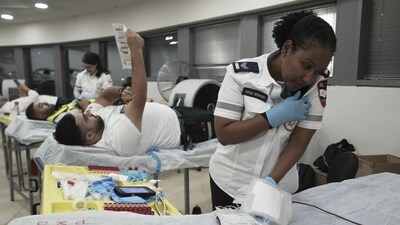 Medics with Israel's Magen David Adom emergency service donate blood to prepare for mass casualties in the event of strikes by Iran, in Jerusalem. (AP Photo/Maya Alleruzzo) Medics with Israel's Magen David Adom emergency service donate blood to prepare for mass casualties in the event of strikes by Iran, in Jerusalem. (AP Photo/Maya Alleruzzo)
