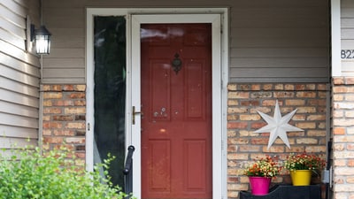 Bullet holes mark the front door of Minnesota state  Senator John Hoffman, who was shot alongside his wife, Yvette, in what is believed to be an attack by 57-year-old suspect Vance Luther Boelter, who is also the lead suspect in the shooting deaths of senior Democratic state assemblywoman Melissa Hortman and her husband, Marc, in Champlin, Minnesota, U.S., June 14, 2025. (REUTERS/Tim Evans) (REUTERS)
