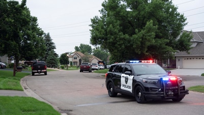 Law enforcement establish a security perimeter near the residence of senior Democratic state assemblywoman, Melissa Hortman. (Reuters)