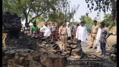 Officials inspect the scene where a hut was reduced to ashes in a lightning strike, killing four members of a family, in Prayagraj. (HT Photo) Officials inspect the scene where a hut was reduced to ashes in a lightning strike, killing four members of a family, in Prayagraj. (HT Photo)