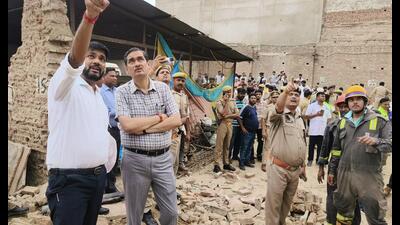Operations continued through the evening as officials searched through the remains of the collapsed structure. (HT Photo) Operations continued through the evening as officials searched through the remains of the collapsed structure. (HT Photo)