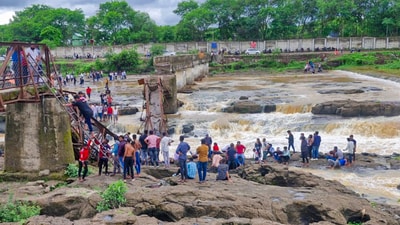 People stand near an iron bridge over the Indrayani river after it collapsed, in Pune district, Maharashtra. Some people are feared to have been swept away after the collapse. (PTI) People stand near an iron bridge over the Indrayani river after it collapsed, in Pune district, Maharashtra. Some people are feared to have been swept away after the collapse. (PTI)