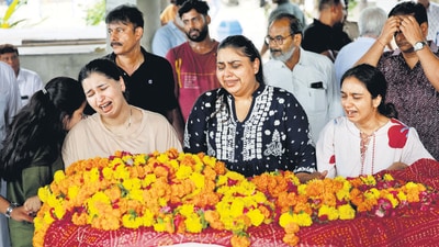 Relatives of Shubh Modi, one of the victims of the Air India crash, during his funeral at a crematorium in Ahmedabad on Sunday. (REUTERS)