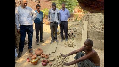 The officials interacting with potters in Prayagraj (HT)