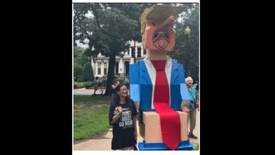 During Trump's DC military parade, an eight-foot statue of him on a toilet became the main attraction amidst heavy rain and protests. (@1MAGAss/X) During Trump's DC military parade, an eight-foot statue of him on a toilet became the main attraction amidst heavy rain and protests. (@1MAGAss/X)