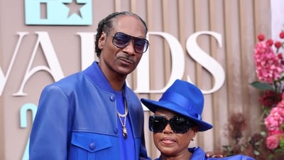 Snoop Dogg and Shante Broadus, high school sweethearts, celebrated their 28th wedding anniversary with adorable social media posts. (Photo by Michael Tran / AFP) (AFP) Snoop Dogg and Shante Broadus, high school sweethearts, celebrated their 28th wedding anniversary with adorable social media posts. (Photo by Michael Tran / AFP) (AFP)