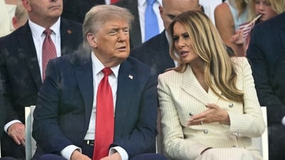 US President Donald Trump (L) speaks to US First Lady Melania Trump as they watch the Army 250th Anniversary Parade from the Ellipse in Washington, DC on June 14, 2025. (AFP) US President Donald Trump (L) speaks to US First Lady Melania Trump as they watch the Army 250th Anniversary Parade from the Ellipse in Washington, DC on June 14, 2025. (AFP)