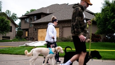 People walk dogs outside the home of DFL State Rep. Melissa Hortman on June 15, 2025 in Brooklyn Park, Minnesota. (Getty Images via AFP) People walk dogs outside the home of DFL State Rep. Melissa Hortman on June 15, 2025 in Brooklyn Park, Minnesota. (Getty Images via AFP)
