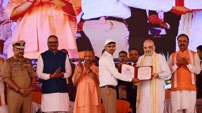 Union home minister Amit Shah at the appointment letter distribution programme in Lucknow on Sunday. Chief minister Yogi Adityanath and other dignitaries were also present. (Deepak Gupta/HT Photo) Union home minister Amit Shah at the appointment letter distribution programme in Lucknow on Sunday. Chief minister Yogi Adityanath and other dignitaries were also present. (Deepak Gupta/HT Photo)