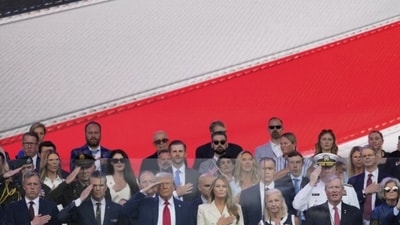 President Donald Trump, first lady Melania Trump, and other guests stand for the National Anthem, during a military parade commemorating the Army’s 250th anniversary, coinciding with his 79th birthday, Saturday, June 14, 2025, in Washington. (AP Photo/Julia Demaree Nikhinson) President Donald Trump, first lady Melania Trump, and other guests stand for the National Anthem, during a military parade commemorating the Army’s 250th anniversary, coinciding with his 79th birthday, Saturday, June 14, 2025, in Washington. (AP Photo/Julia Demaree Nikhinson)