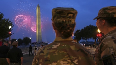 U.S. Army 2nd Lt. Hayle Mayer, left, and Corporal Addison Merrell, watch fireworks at the Washington Monument while attending a military parade commemorating the Army’s 250th anniversary and coinciding with President Donald Trump’s 79th birthday, Saturday, June 14, 2025, in Washington. (AP Photo/Jacquelyn Martin) U.S. Army 2nd Lt. Hayle Mayer, left, and Corporal Addison Merrell, watch fireworks at the Washington Monument while attending a military parade commemorating the Army’s 250th anniversary and coinciding with President Donald Trump’s 79th birthday, Saturday, June 14, 2025, in Washington. (AP Photo/Jacquelyn Martin)
