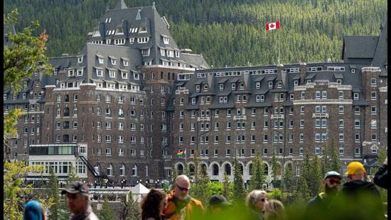 Tourists in front of the Fairmont Banff Springs Hotel ahead of the Group of Seven (G-7) Leaders' Summit, in Banff, Alberta, Canada, on Saturday. (Bloomberg)