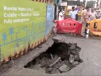 A portion of the road near Girgaon Metro Station in Mumbai caved in today. A BEST bus got stuck in the caved-in portion. Latest visuals from the site. A portion of the road near Girgaon Metro Station in Mumbai caved in today. A BEST bus got stuck in the caved-in portion. Latest visuals from the site.