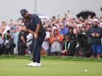 JJ Spaun putts on the 18th green to win during the final round of the U.S. Open golf tournament.