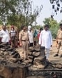 Officials inspect the scene where a hut was reduced to ashes in a lightning strike, killing four members of a family, in Prayagraj. (HT Photo)