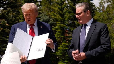President Donald Trump drops papers as he meets with Britain's Prime Minister Keir Starmer on the sidelines of the G7 Summit, Monday, June 16, 2025, in Kananaskis, Canada. (AP Photo/Mark Schiefelbein) (AP) President Donald Trump drops papers as he meets with Britain's Prime Minister Keir Starmer on the sidelines of the G7 Summit, Monday, June 16, 2025, in Kananaskis, Canada. (AP Photo/Mark Schiefelbein) (AP)