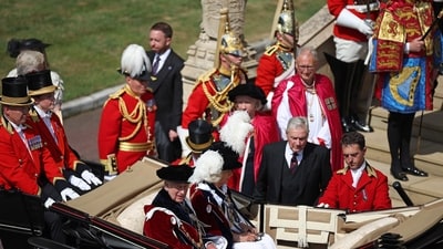 Britain's King Charles III and Britain's Queen Camilla prepare to leave after the Order of the Garter service at St George's Chapel in Windsor Castle, southern England, on June 16, 2025. (AFP) Britain's King Charles III and Britain's Queen Camilla prepare to leave after the Order of the Garter service at St George's Chapel in Windsor Castle, southern England, on June 16, 2025. (AFP)