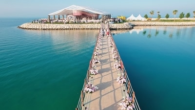 A petal-strewn bridge leads you to a tucked-away island reserved exlclusively for luxury weddings. A petal-strewn bridge leads you to a tucked-away island reserved exlclusively for luxury weddings.