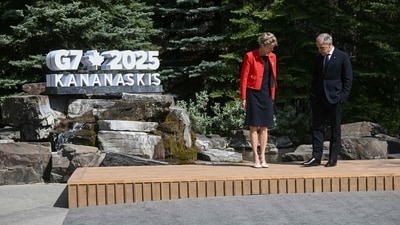 Canadian Prime Minister Mark Carney and his wife Diana Fox Carney arrive to welcome G7 leadears during an arrival ceremony at the Group of Seven (G7) Summit at the Pomeroy Kananaskis Mountain Lodge in Kananaskis, Alberta, Canada on June 16, 2025. (Photo by Brendan SMIALOWSKI / AFP) (AFP) Canadian Prime Minister Mark Carney and his wife Diana Fox Carney arrive to welcome G7 leadears during an arrival ceremony at the Group of Seven (G7) Summit at the Pomeroy Kananaskis Mountain Lodge in Kananaskis, Alberta, Canada on June 16, 2025. (Photo by Brendan SMIALOWSKI / AFP) (AFP)
