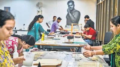 Conservators at Indira Gandhi National Centre for the Arts (IGNCA) work on preserving detailed maps of Shahjahanabad made by British surveyor AJ Wilson. (Raj K Raj/HT Photo) Conservators at Indira Gandhi National Centre for the Arts (IGNCA) work on preserving detailed maps of Shahjahanabad made by British surveyor AJ Wilson. (Raj K Raj/HT Photo)