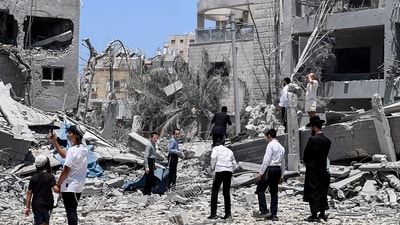 Jews look at an impacted site following missile attack from Iran on Israel, in Bnei Brak, Israel. (Reuters)