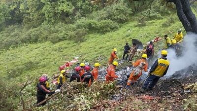 NDRF and SDRF personnel at the spot after a helicopter crashed near the Kedarnath shrine, in Rudraprayag district, Uttarakhand, on Sunday. (NDRF) NDRF and SDRF personnel at the spot after a helicopter crashed near the Kedarnath shrine, in Rudraprayag district, Uttarakhand, on Sunday. (NDRF)