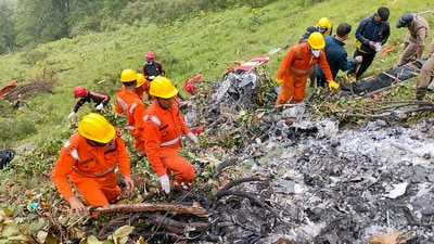 NDRF and SDRF personnel at the spot after a helicopter crashed near the Kedarnath shrine, in Rudraprayag district, Uttarakhand, Sunday. (NDRF) NDRF and SDRF personnel at the spot after a helicopter crashed near the Kedarnath shrine, in Rudraprayag district, Uttarakhand, Sunday. (NDRF)