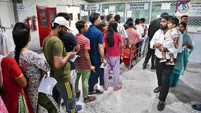 People queue up to collect their Covid-19 test reports. (Sunil Ghosh / HT Photo) People queue up to collect their Covid-19 test reports. (Sunil Ghosh / HT Photo)