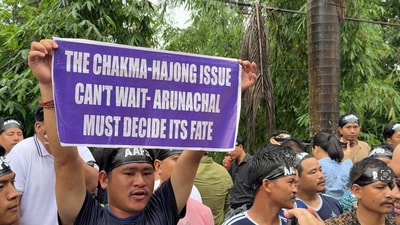 Protestors hold placards during the rally demanding the deportation of illegal immigrants. (HT Photo)